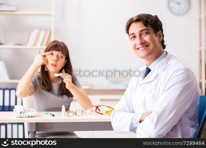 Young woman visiting male doctor ophthalmologist in hospital