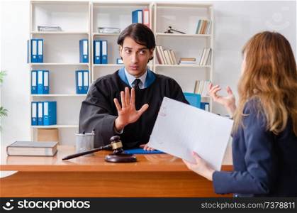 Young woman visiting male lawyer 