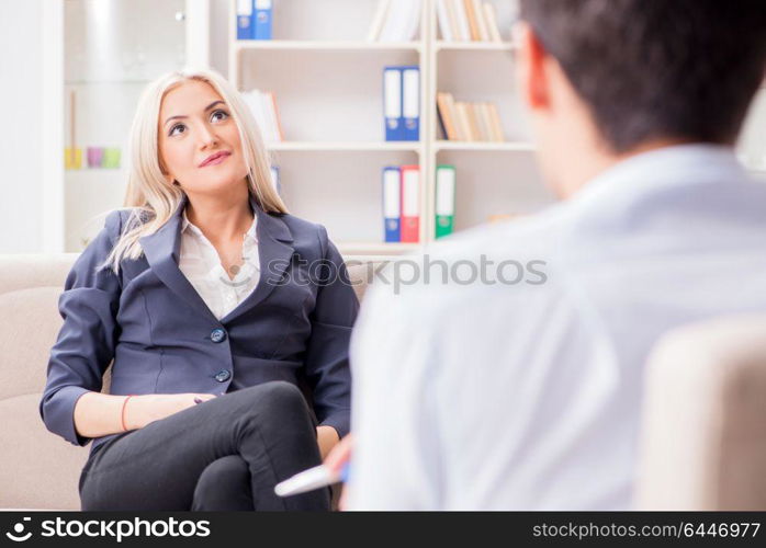 Young woman visiting psychiatrist man doctor for consultation