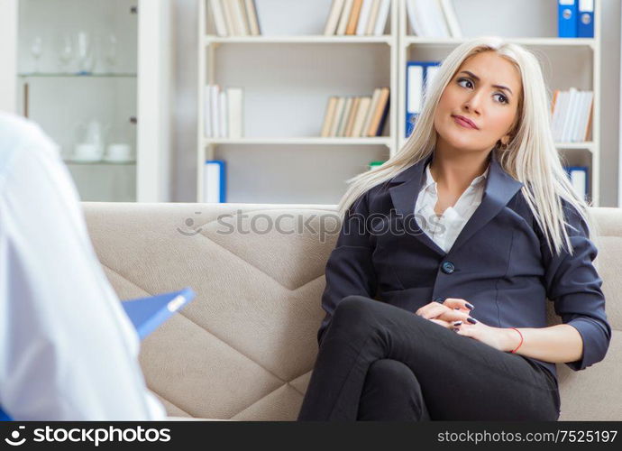 Young woman visiting psychiatrist man doctor for consultation. The young woman visiting psychiatrist man doctor for consultatio