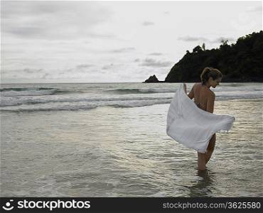 Young Woman Wading in Ocean