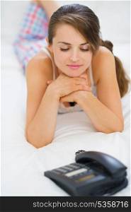 Young woman waiting phone call