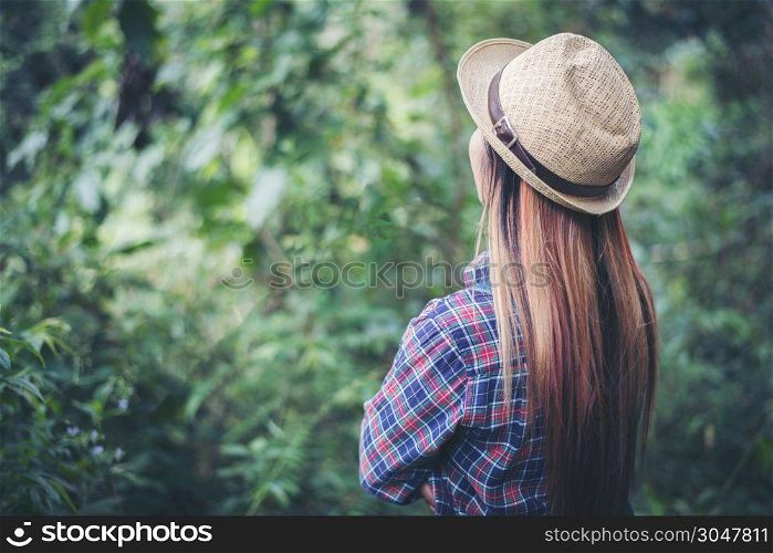 young woman walking in the forest