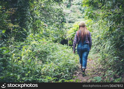 young woman walking in the forest