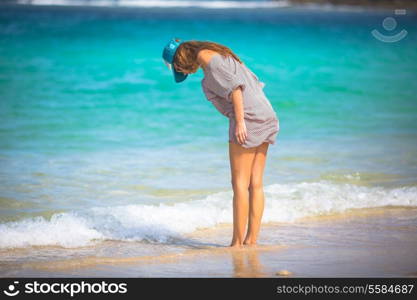 Young woman walking on beach