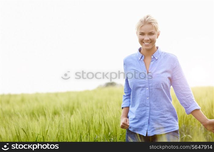 Young Woman Walking Through Field