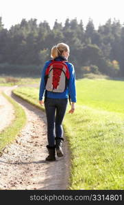 Young woman walks in park