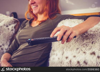 Young woman watching television