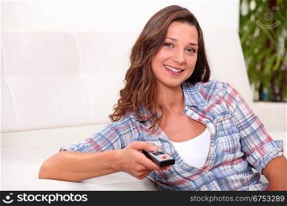 Young woman watching television