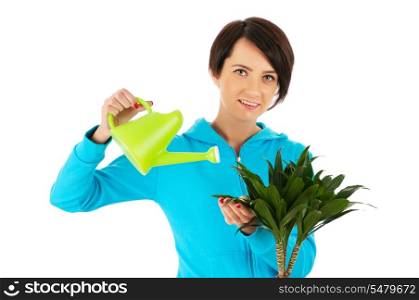 Young woman watering plants isolated on white