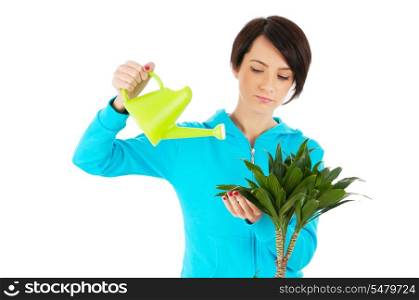 Young woman watering plants isolated on white
