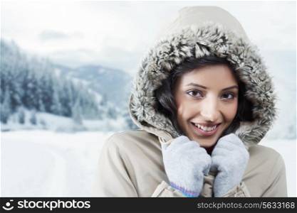 Young woman wearing a hood outdoors