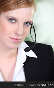 Young woman wearing a telephone headset