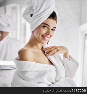 young woman wearing bathrobe towel her hair 3