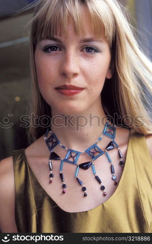 Young Woman Wearing Beaded Necklace