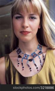Young Woman Wearing Beaded Necklace