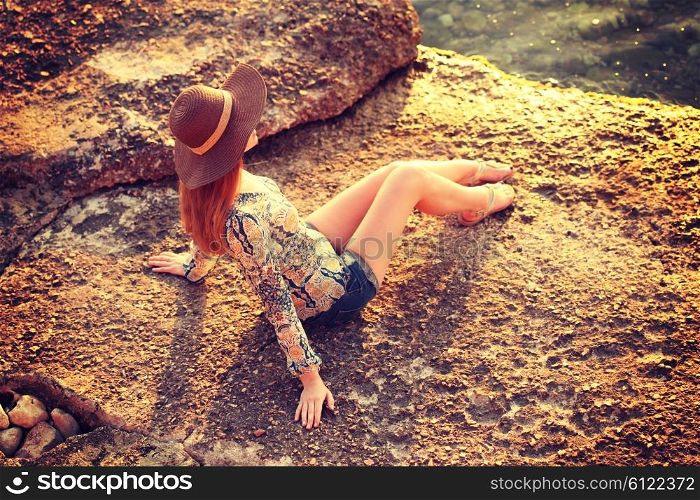 young woman wearing boho style clothes enjoy in summer day on the beach, retro colors