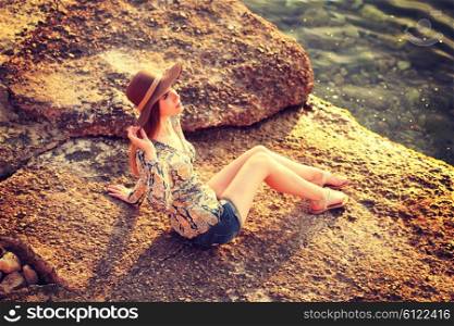 young woman wearing boho style clothes enjoy in summer day on the beach, retro colors
