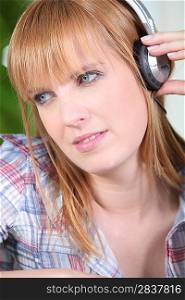 young woman wearing earphones