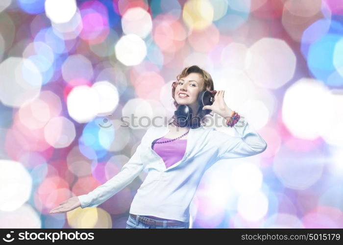 Young woman wearing headphones against bokeh background