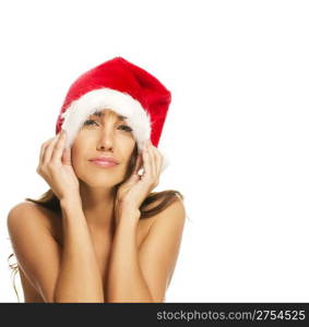 young woman wearing santas hat making faces. young woman wearing santas hat making faces on white background