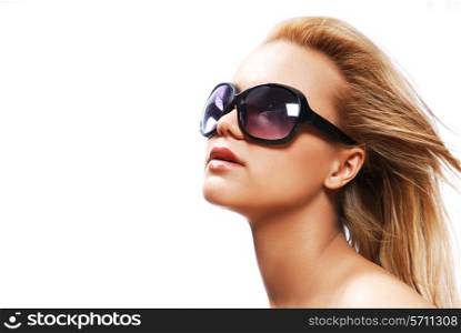 Young woman wearing the big modern sunglasses. Studio shot on a white background