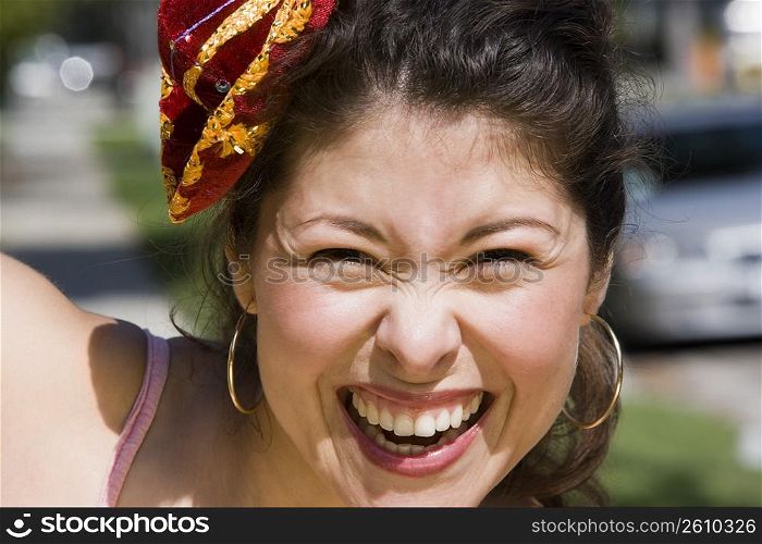 Young woman wearing tiny Mexican sombrero