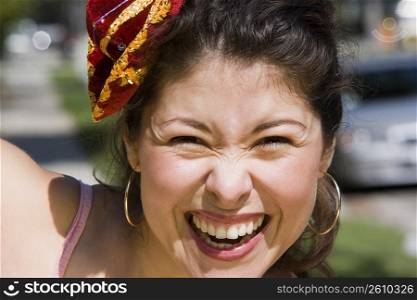 Young woman wearing tiny Mexican sombrero