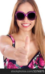 Young woman wearing violet framed sunglass and showing her thumbs up over white background