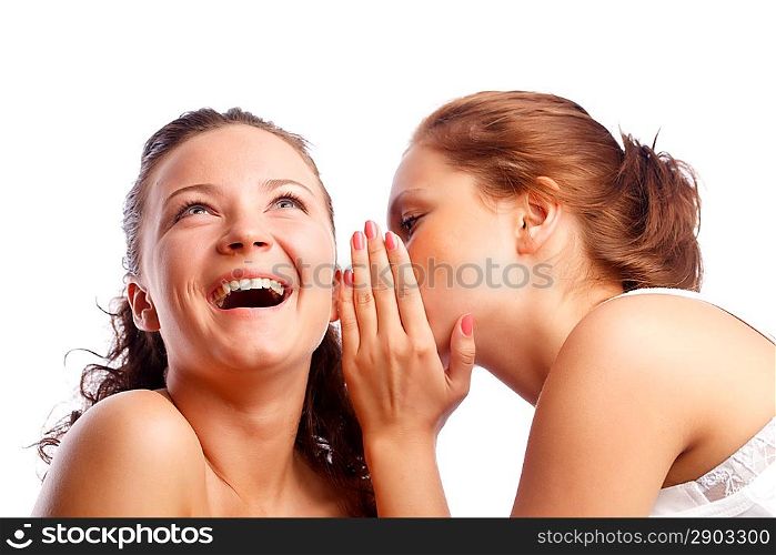 Young woman whispering something to her friend.