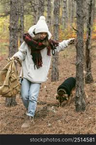 young woman winter clothes with her dog