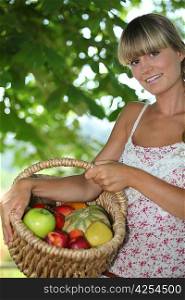 Young woman with a basket of fruit