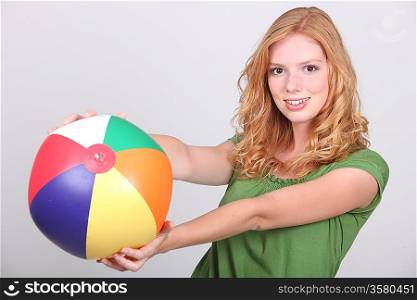 young woman with a beach ball