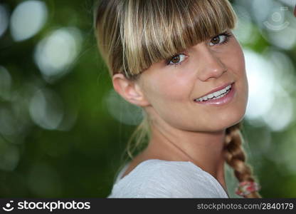 Young woman with a blunt fringe outdoors