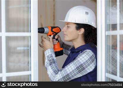 young woman with a drill