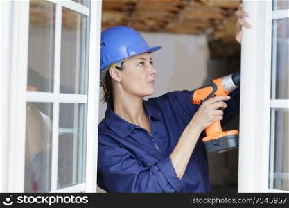 young woman with a drill
