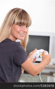 Young woman with a games console