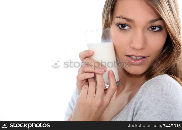 Young woman with a glass of milk