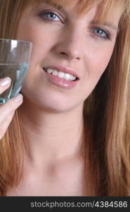 Young woman with a glass of water