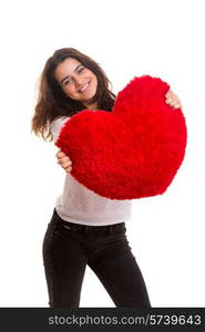 Young woman with a heart pillow in her hands - Valentines day concept