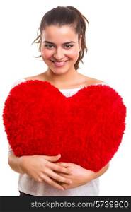 Young woman with a heart pillow in her hands - Valentines day concept