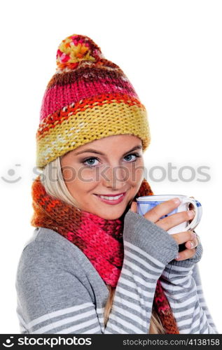 young woman with a hood warms up with hot tea.