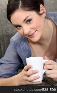 Young woman with a mug of tea
