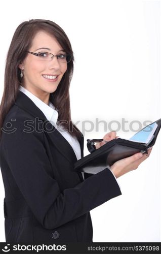 Young woman with a personal organizer