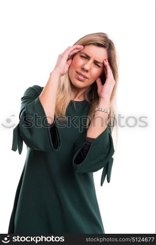Young woman with a strong headache, isolated over white background