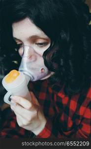 Young woman with an asthma attack