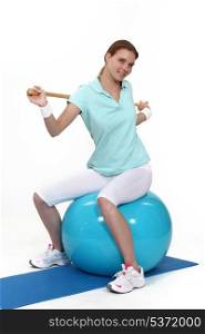 Young woman with an exercise ball