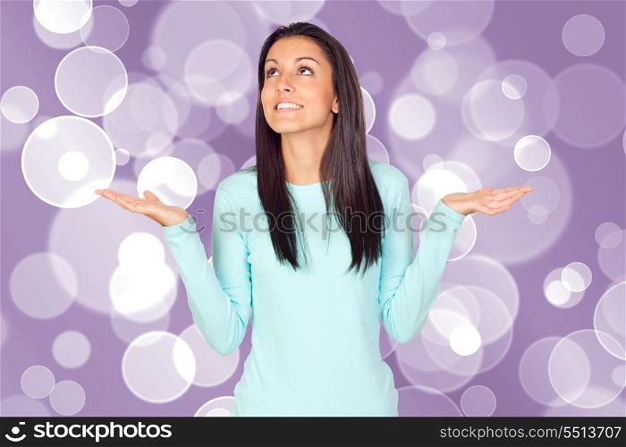 Young woman with arms opened isolated over a white background