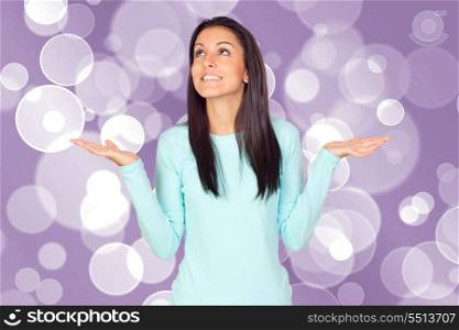 Young woman with arms opened isolated over a white background