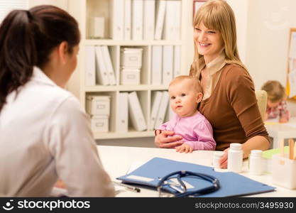 Young woman with baby girl visit pediatrician office for medical check-up